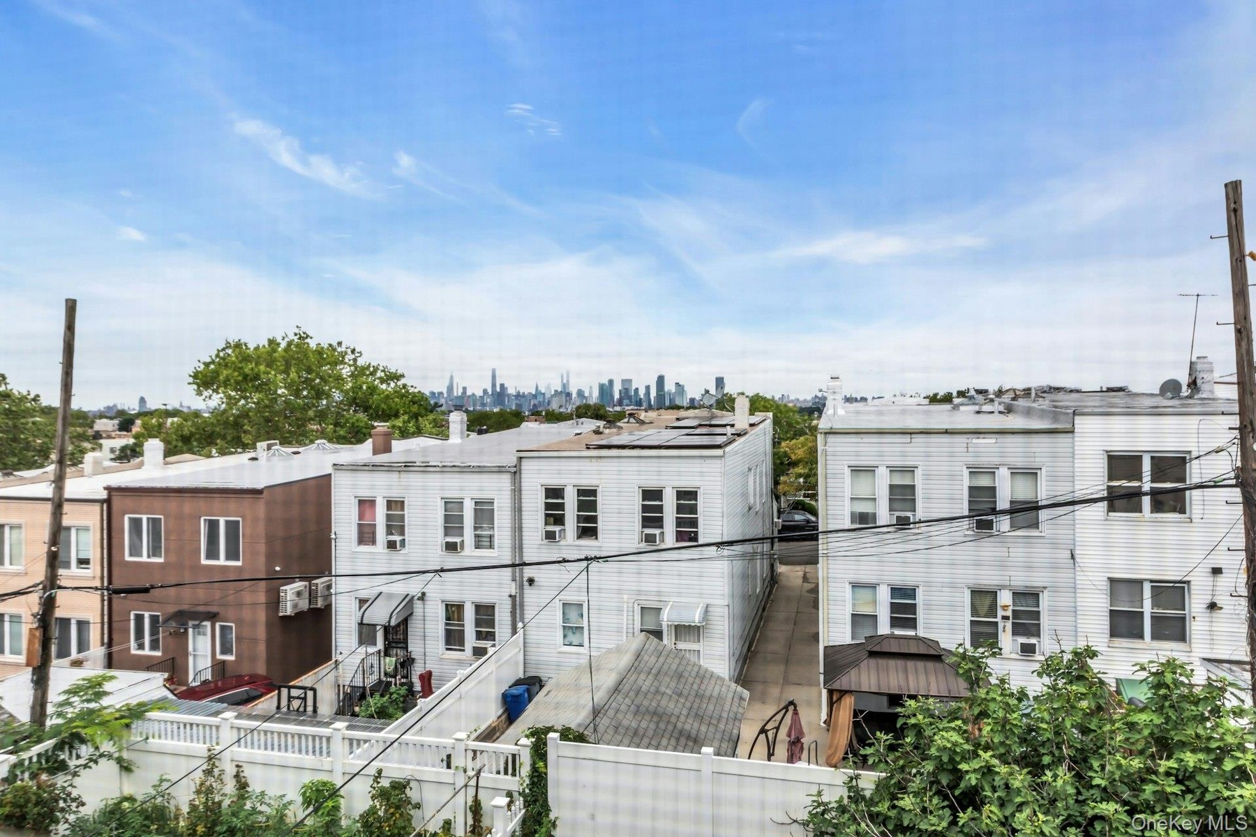 View from top floor bedroom of main unit. Manhattan skyline in the distance.  NYC is 7 miles from 6417 Eliot Avenue.