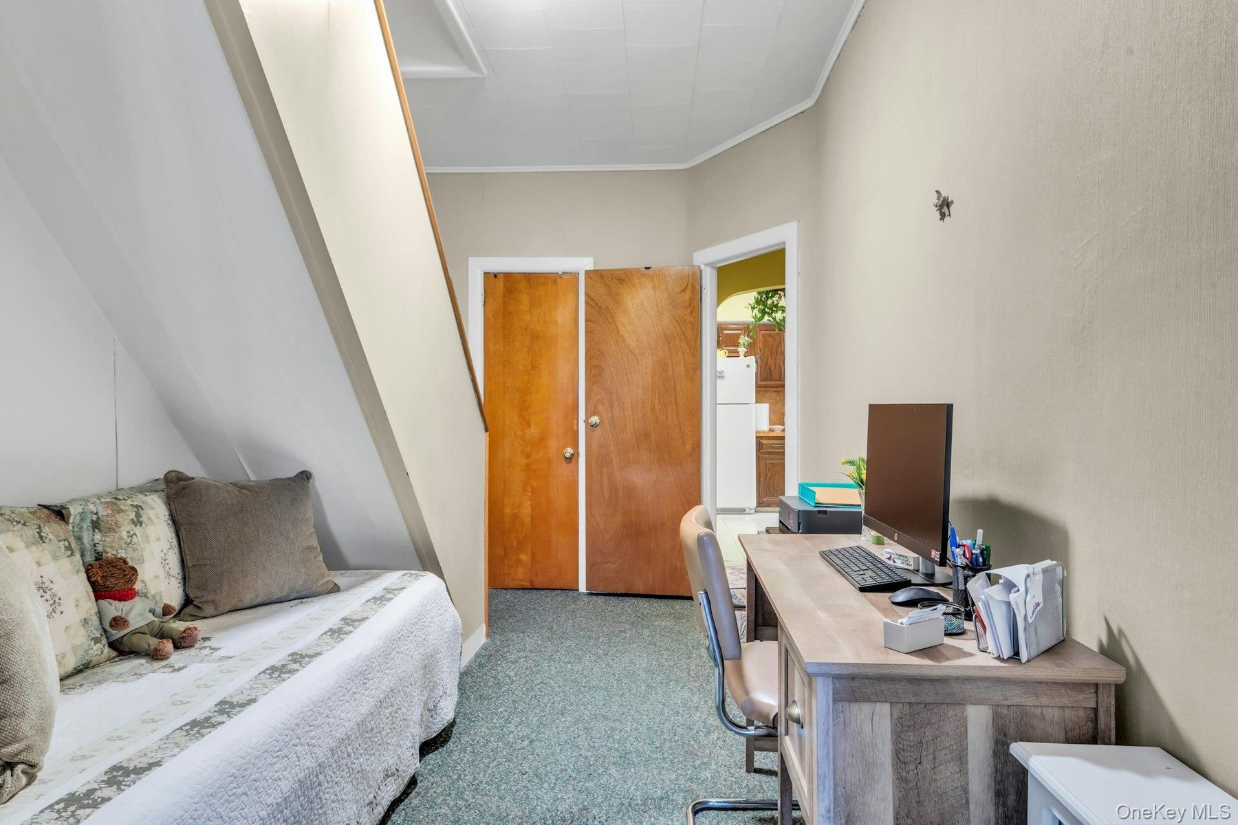 Stairs to top floor and spacious bedroom.