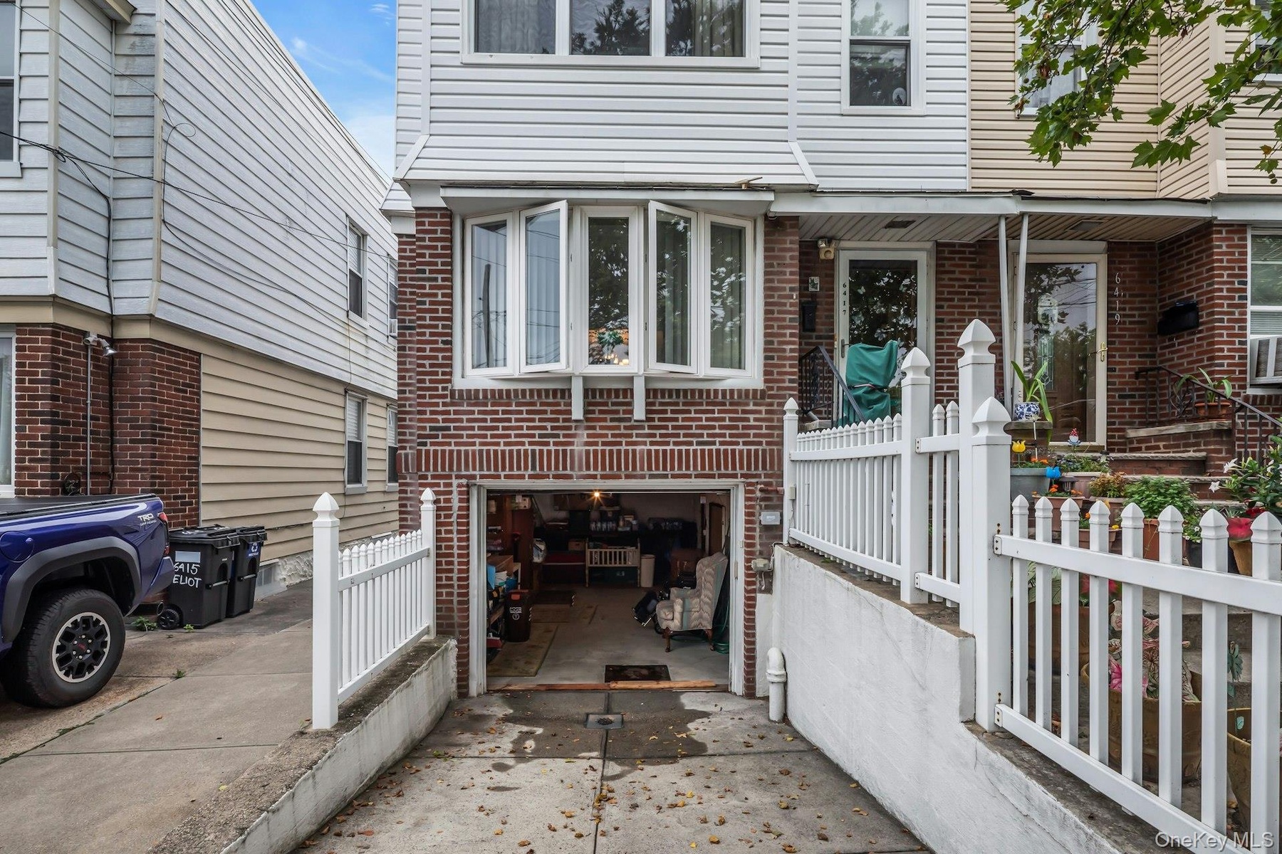 Driveway and garage below home.
