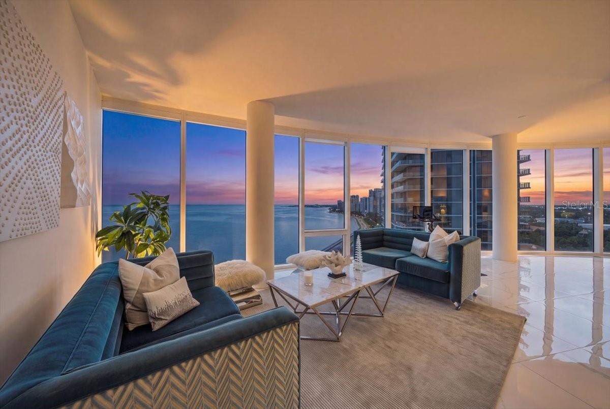 Spacious living area with panoramic waterfront views.