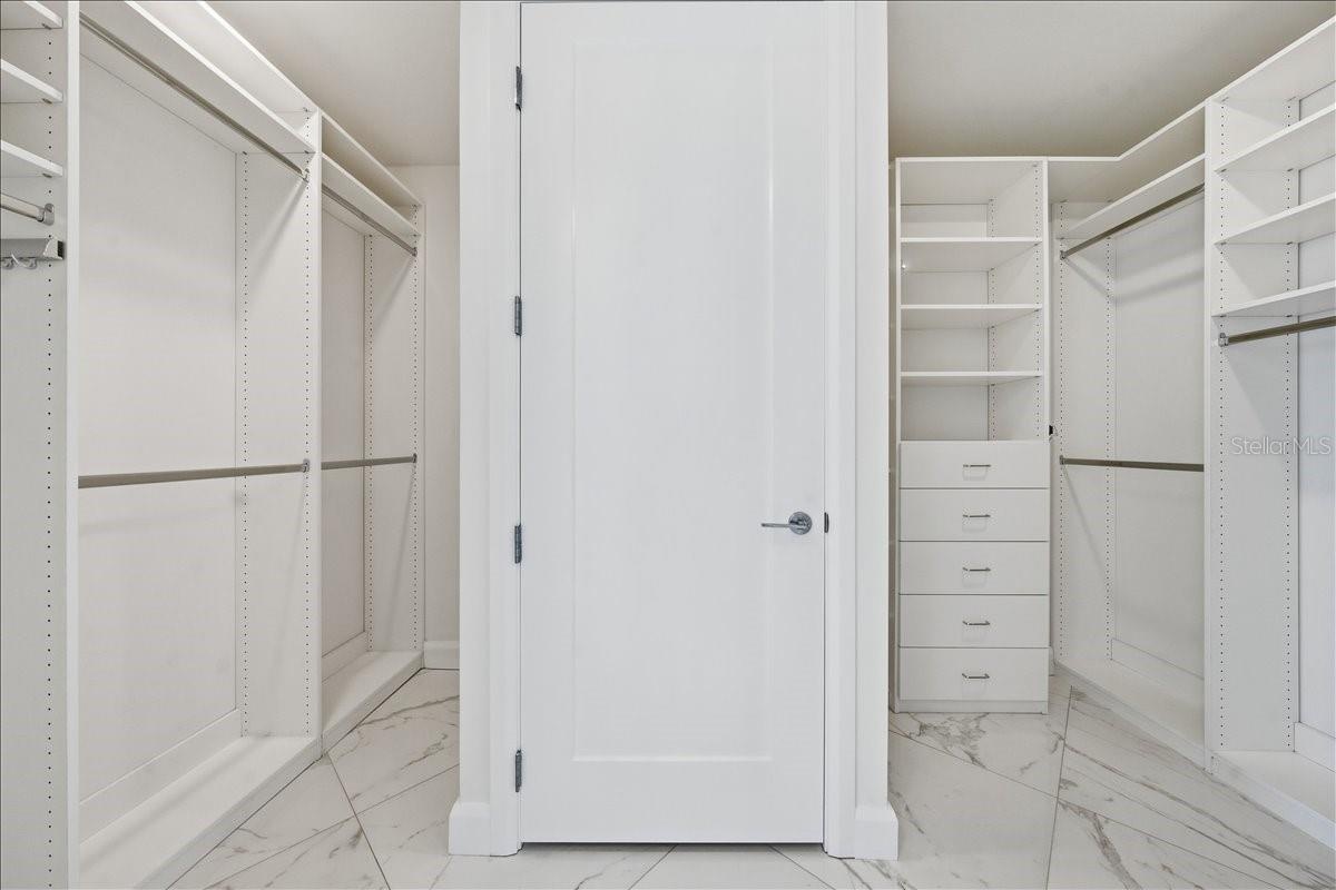 Spacious closet with generous storage.