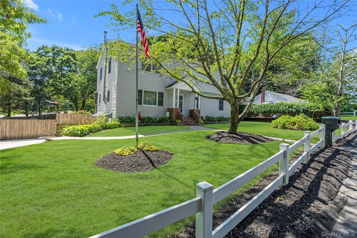 Siding exterior with a covered porch entry