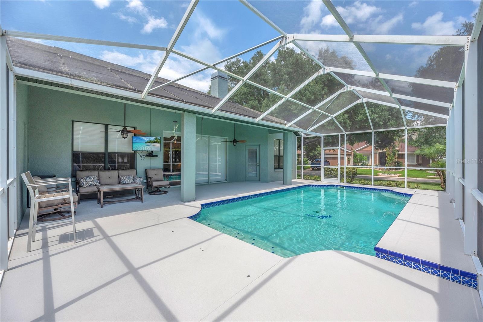 Oversized screened pool and covered patio and lanai.