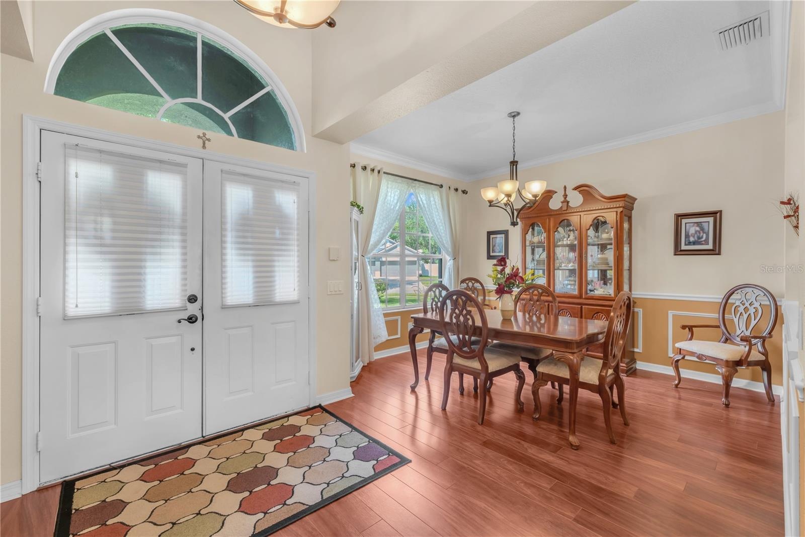 Just inside the front doors is the dining room with crown, chair rail and picture frame moldings.