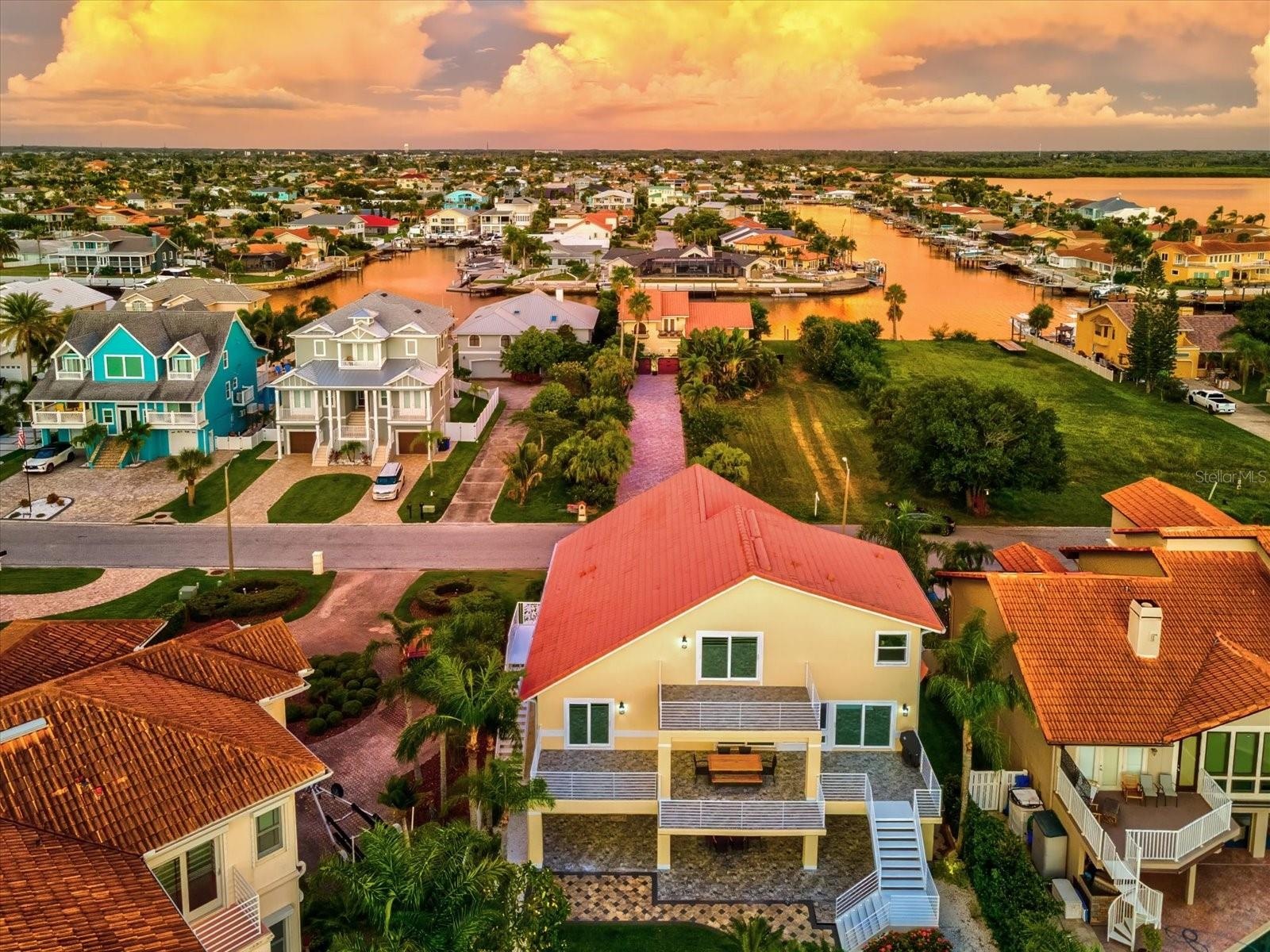Luxury coastal estate, open concept, chef’s kitchen, Sub-Zero appliances, spa-inspired bathrooms, Jacuzzi tub, granite vanities, custom tile, plantati