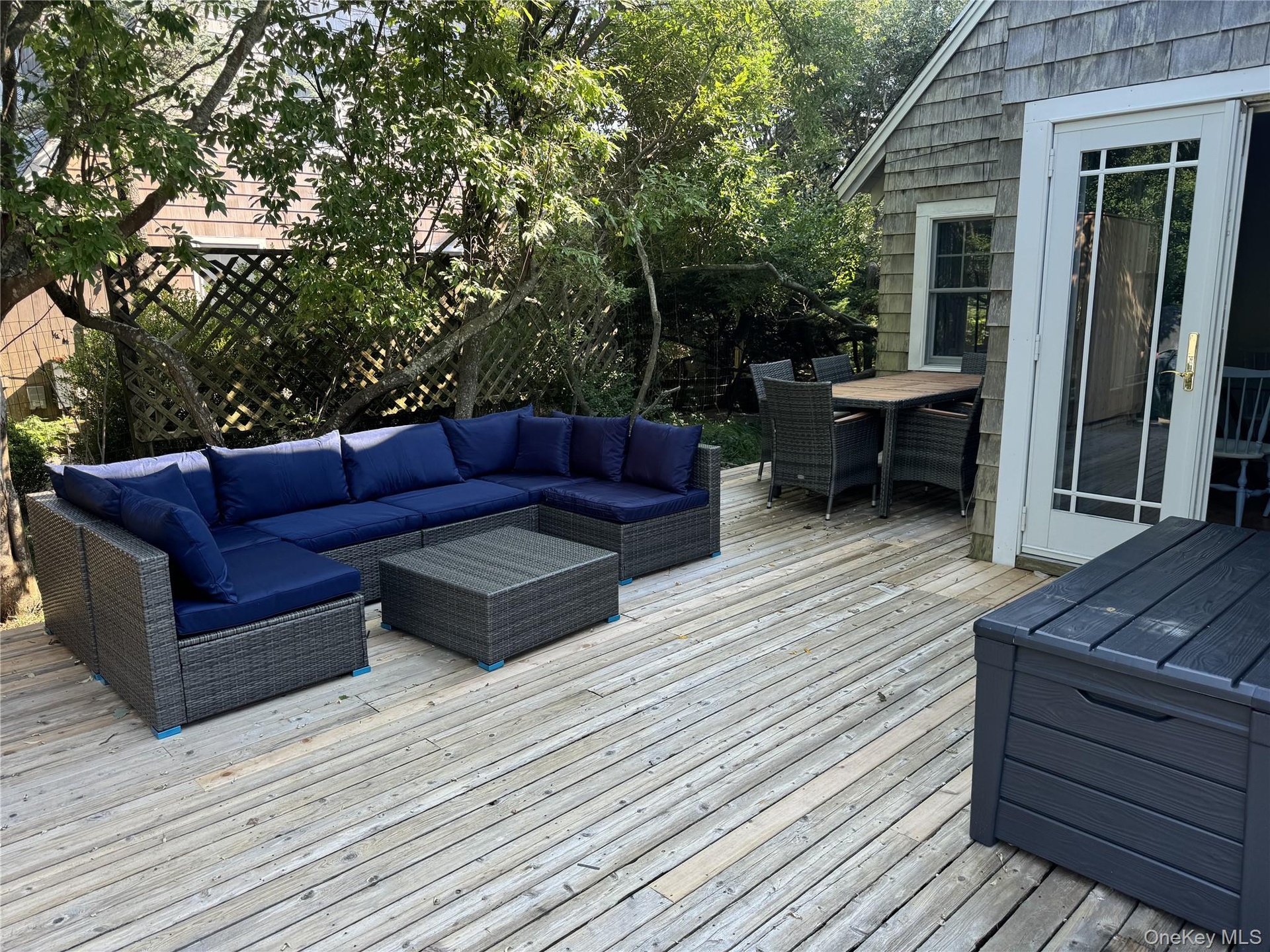 Deck with outdoor lounge area and outdoor dining area