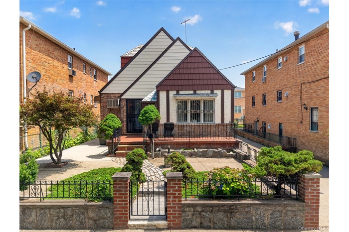 Tudor-style residence with a distinct gabled roofline and a brick and stucco exterior