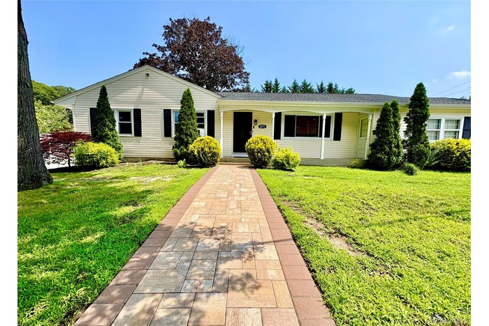 Front of home with new paver walkway.