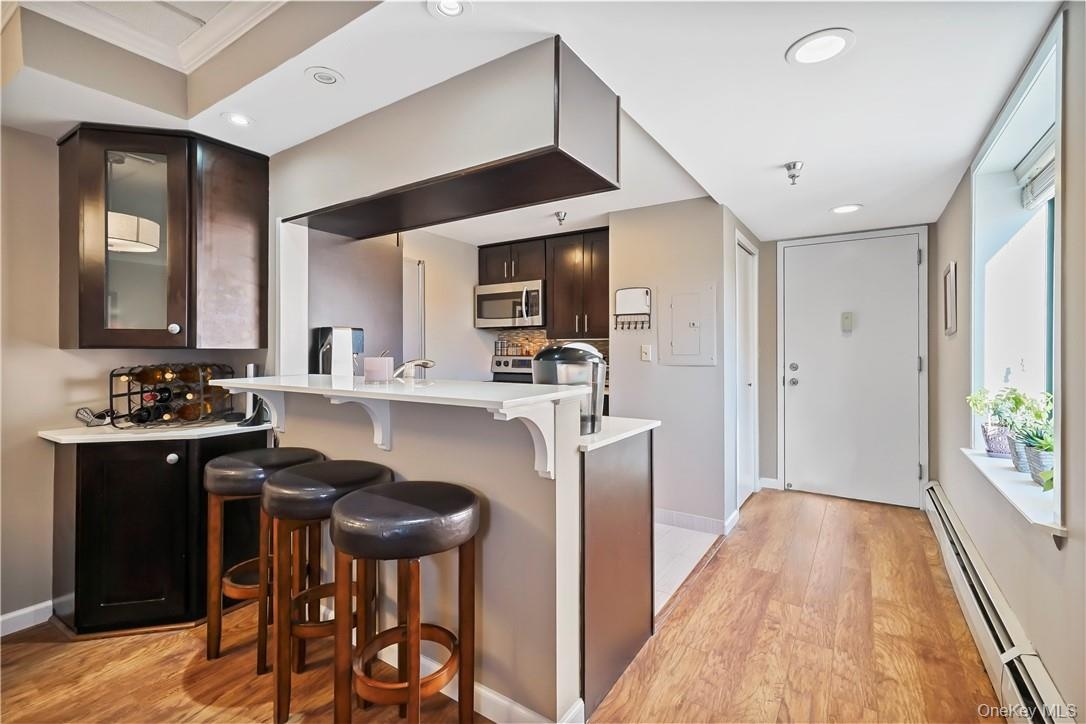 Entry Hall & Kitchen View With Eat-in Counter