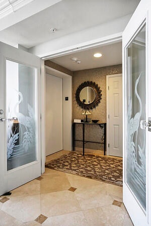 Private foyer entry w/ French doors to main living area