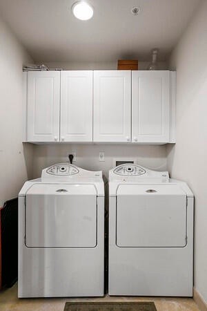 Separate laundry RM w/ full side by side Washer & Dryer