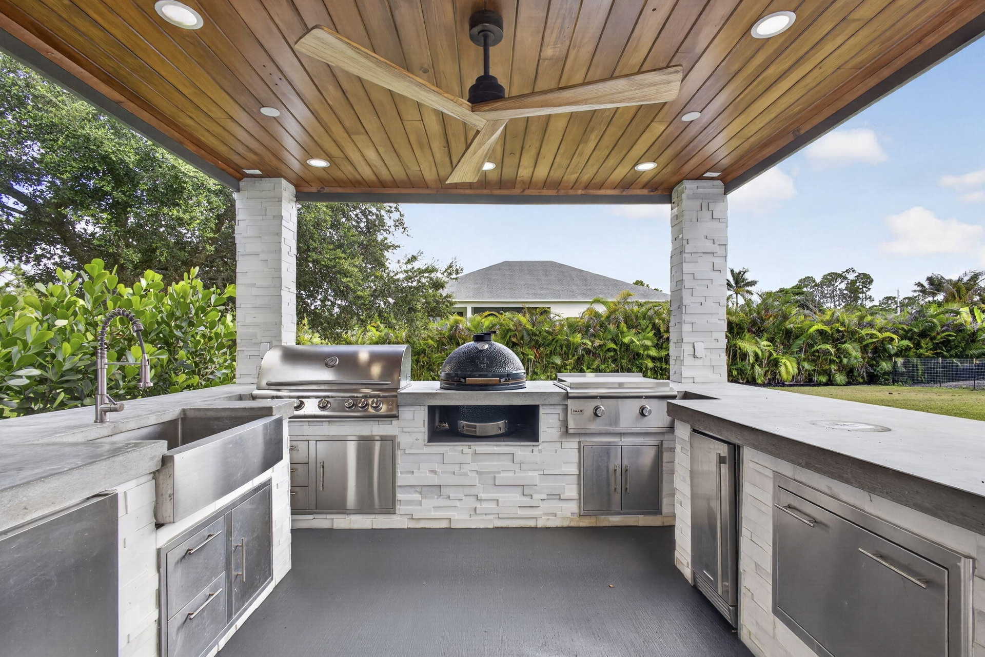 XL BIG GREEN EGG, PROPANE GRILL & PROPANE HIBACHI GRILL ALL BUILT IN TO THIS GORGEOUS SUMMER KITCHEN. CONCRETE WORK DONE BY THIEL STUDIOS