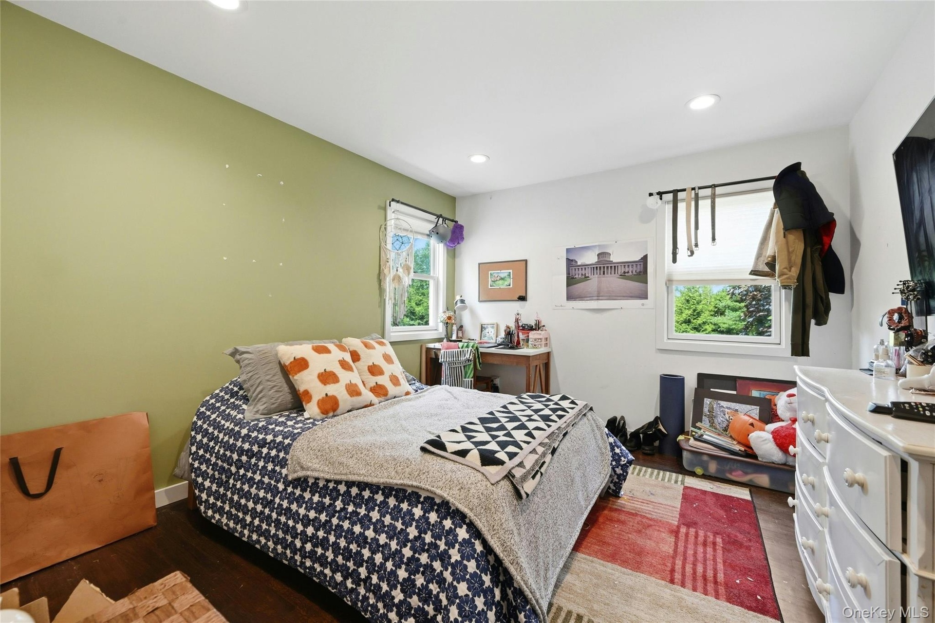 Secondary Bedroom featuring wood-finish flooring, recessed lighting, and two double-hung windows