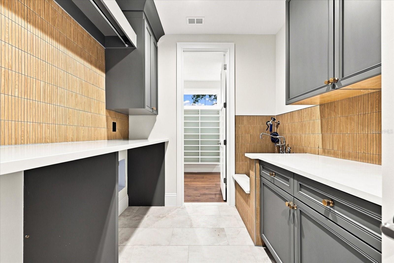 Laundry Room set up for 2 sets of washer/dryers