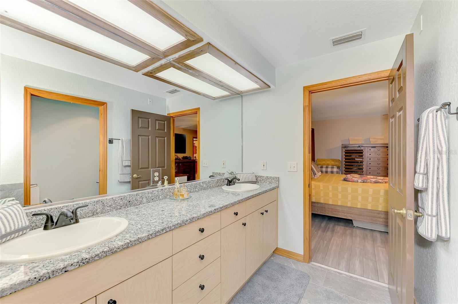 Primary bathroom with oversized cast iron soaker tub, separate shower and water closet