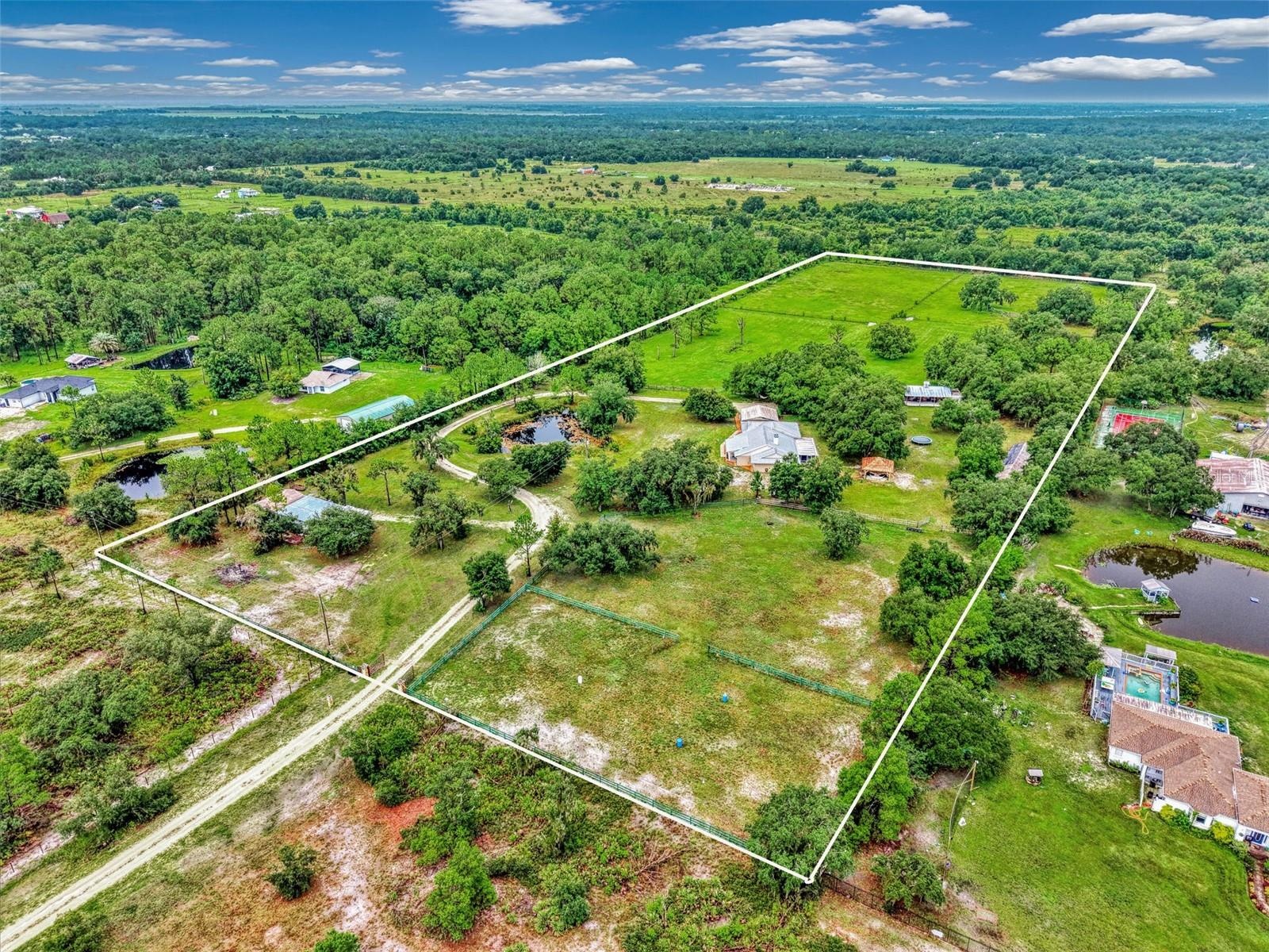 Long private driveway to the property, come through the gate and the shop is on the left side