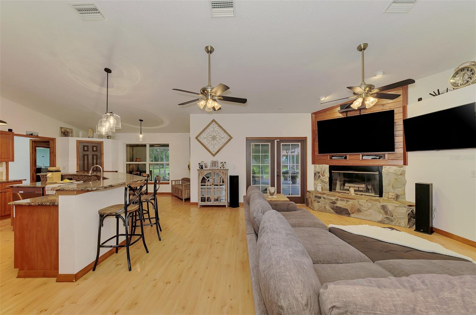 French doors lead to the super-sized screened lanai