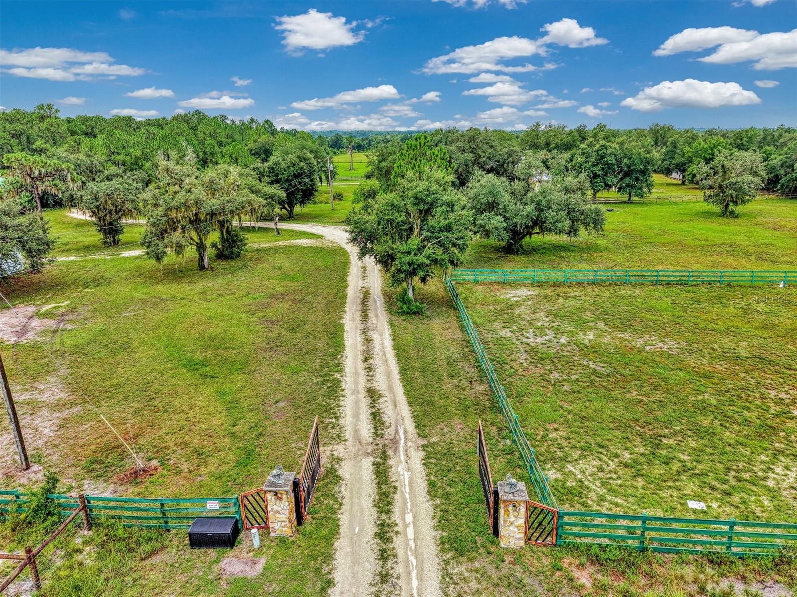 100x200 grass riding arena on the right and an exercise paddock behind it