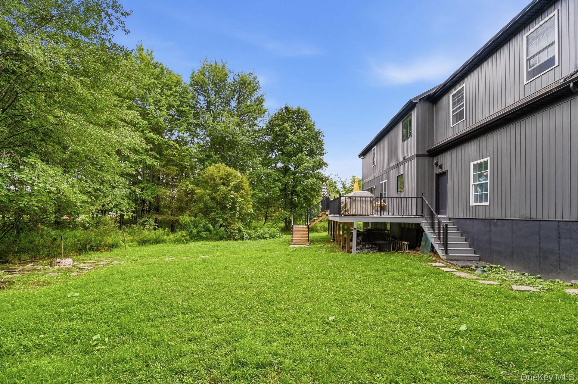 Expansive green lawn providing abundant outdoor space