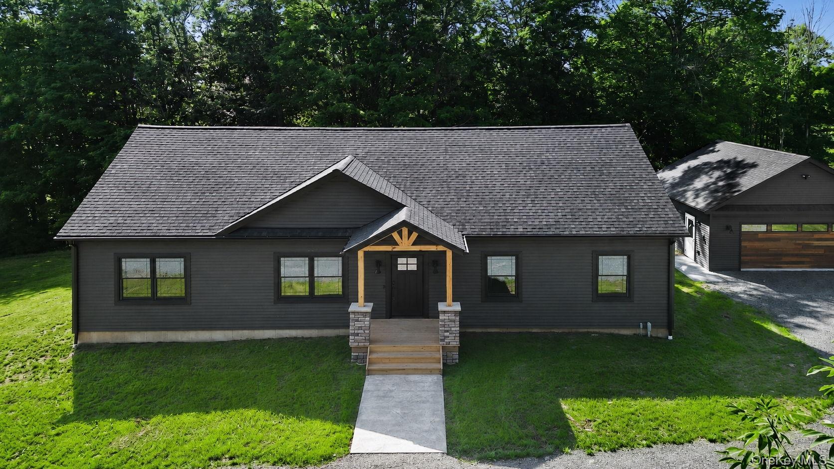Front of home, masonry work to be completed - digitally enhanced here.