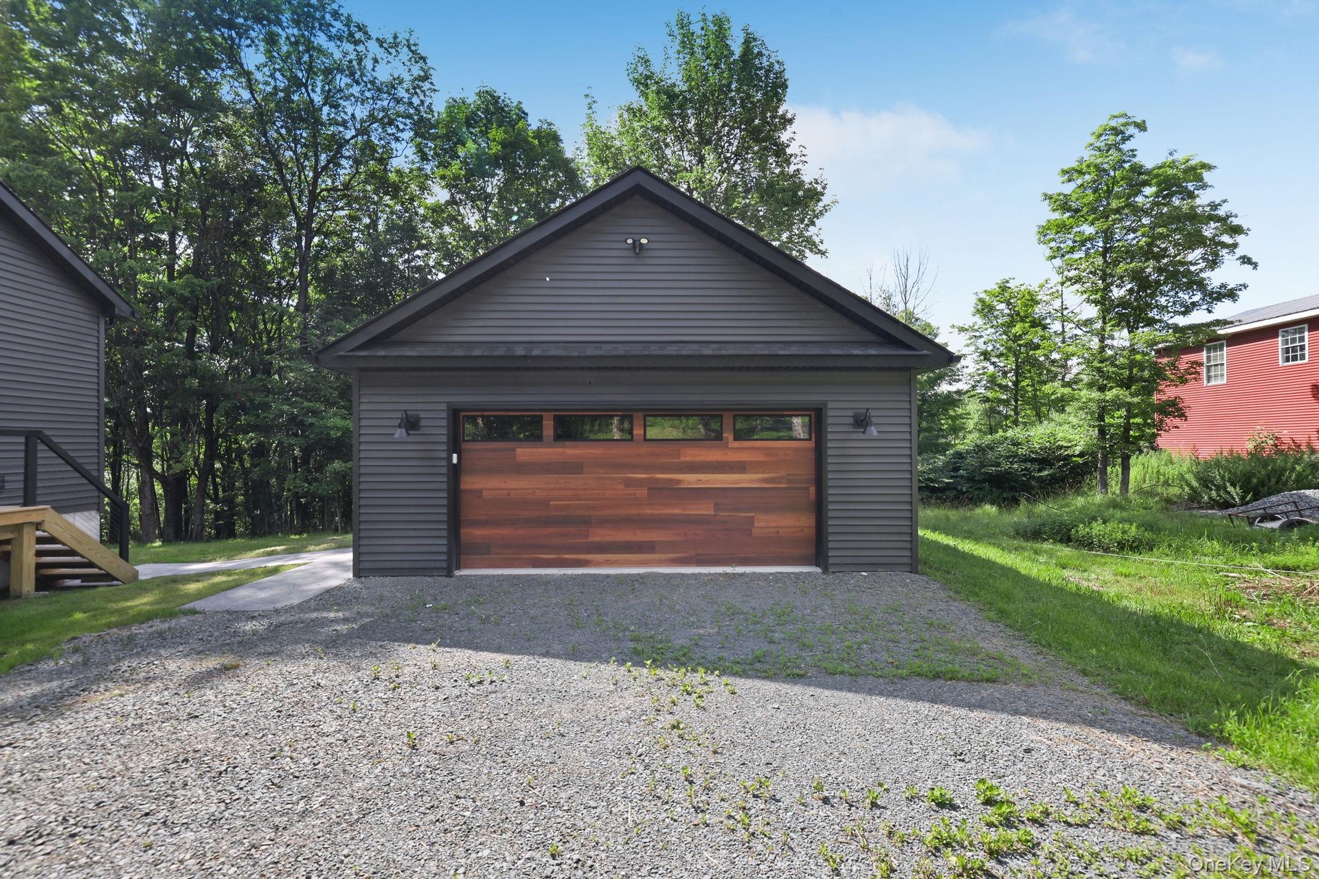 Two car garage from with walkway to the home.