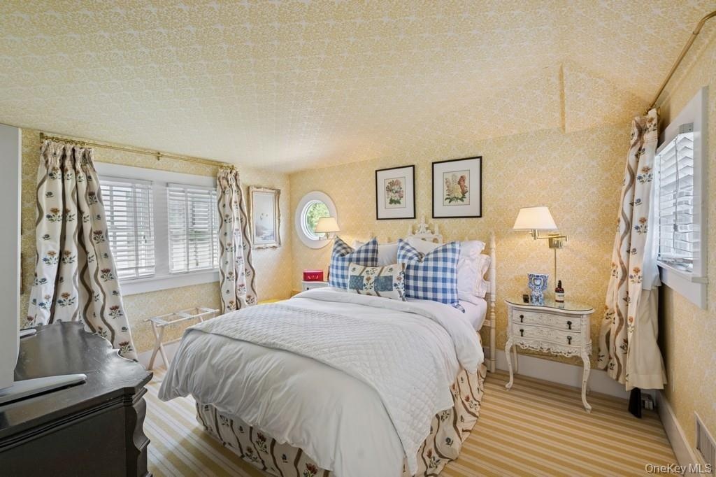 Bedroom with baseboards and carpet floors