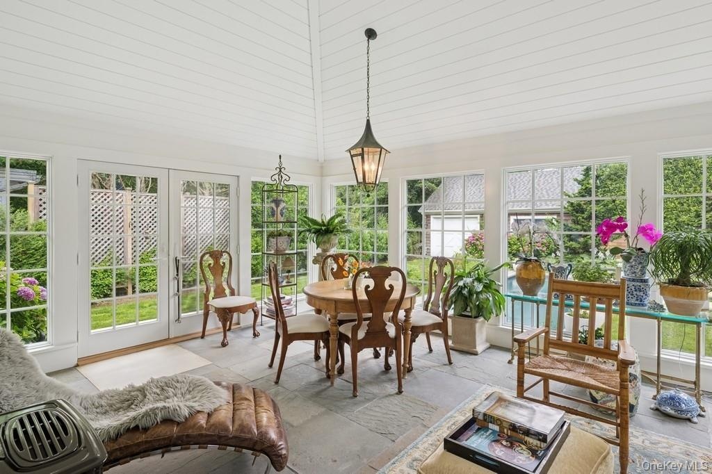 4 seasons Sunroom with healthy amount of natural light and french doors