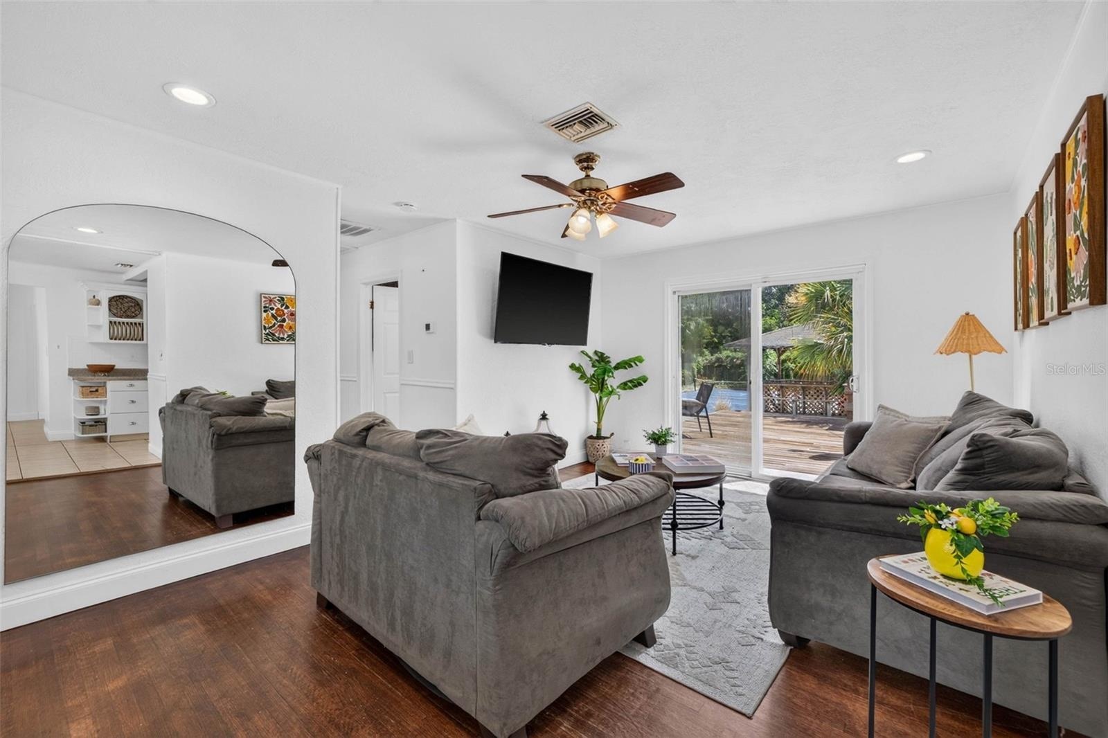 Living room with easy access to the backyard of your dreams.