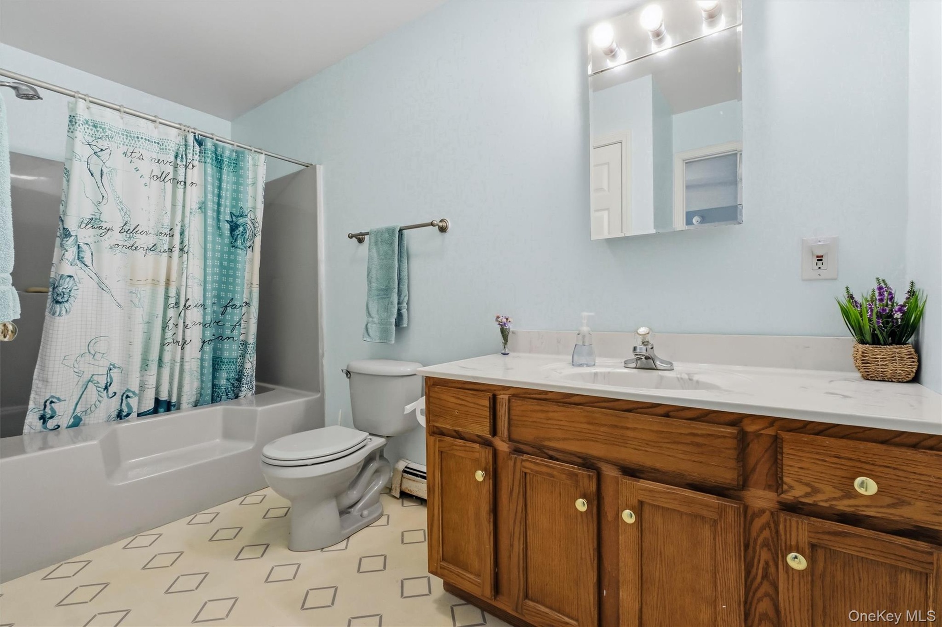 Easy step in tub and oversized vanity for all your necessities.