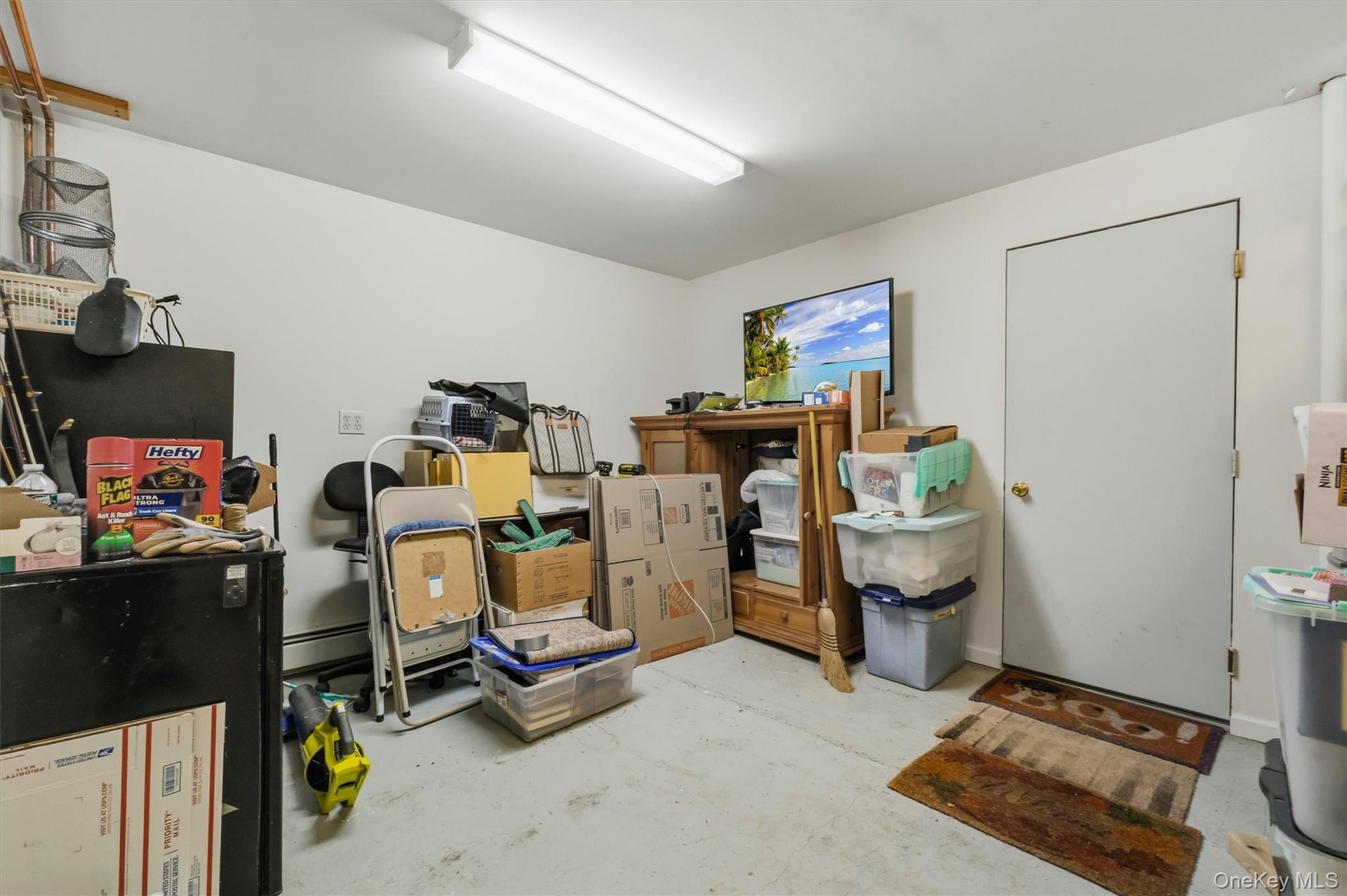 This is the oversized additional room for storage just inside the garage