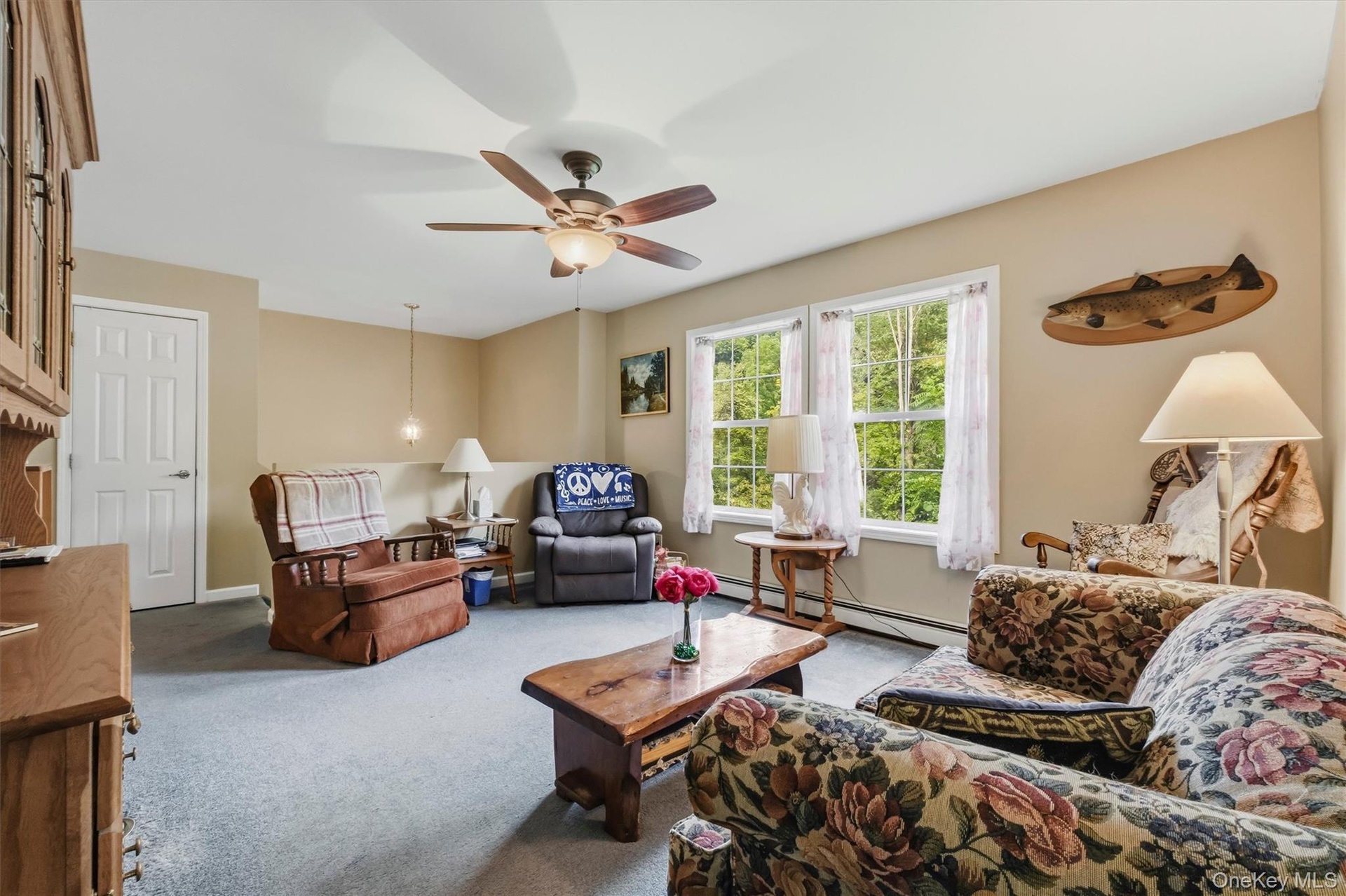Just a few steps upstairs brings you to the bright generous living room