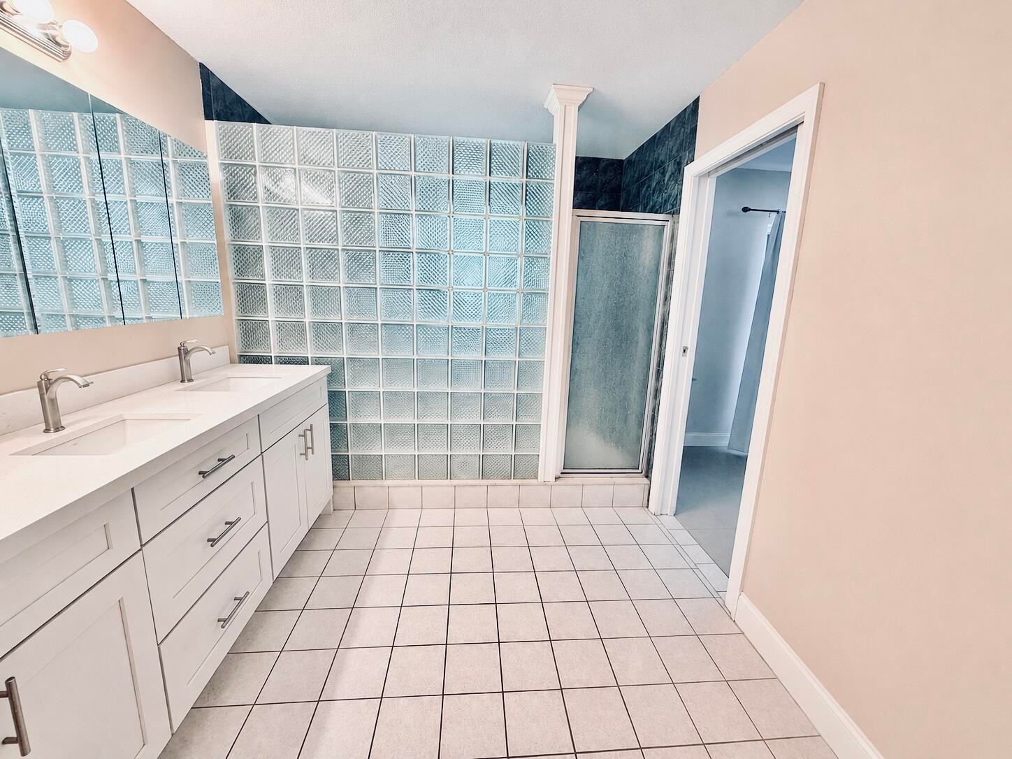 Dual vanity with undermount sinks and modern faucets
