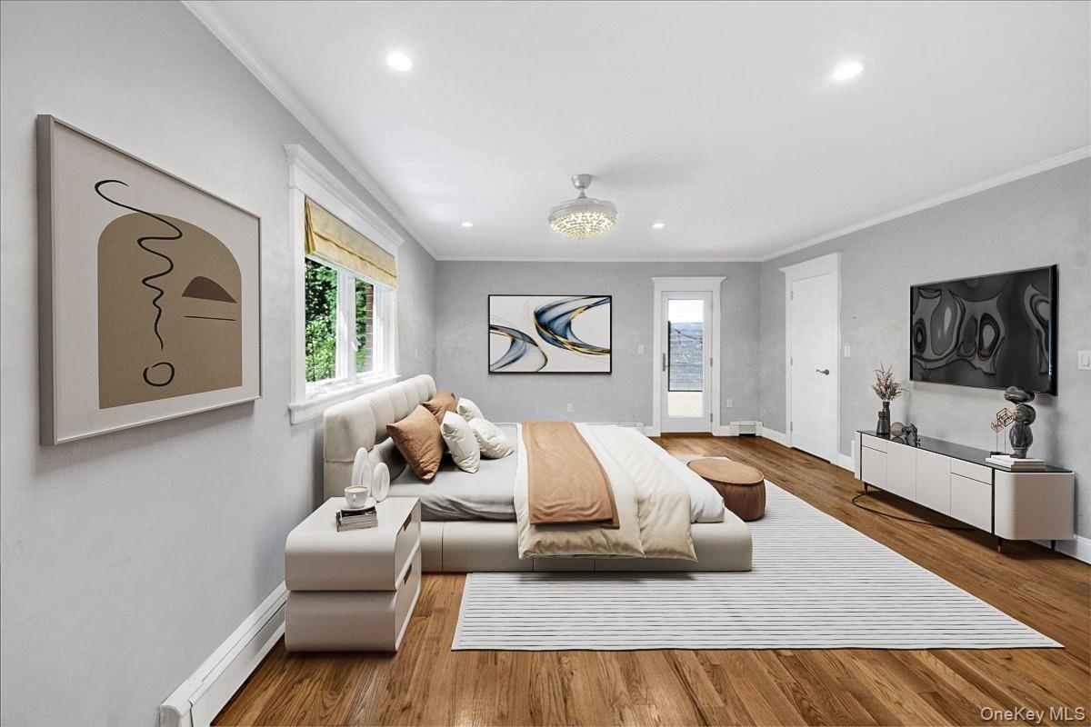 Second angle of primary bedroom (furniture has been virtually staged)