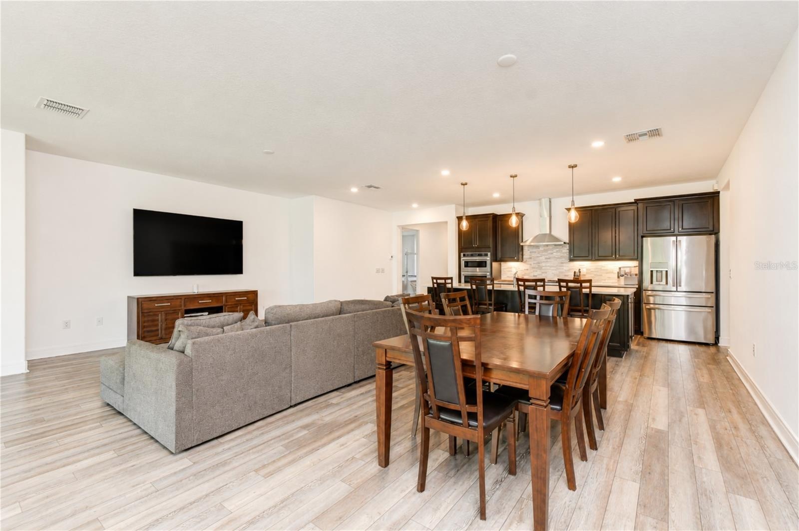 Durable luxury vinyl flooring flowing throughout the main living areas.