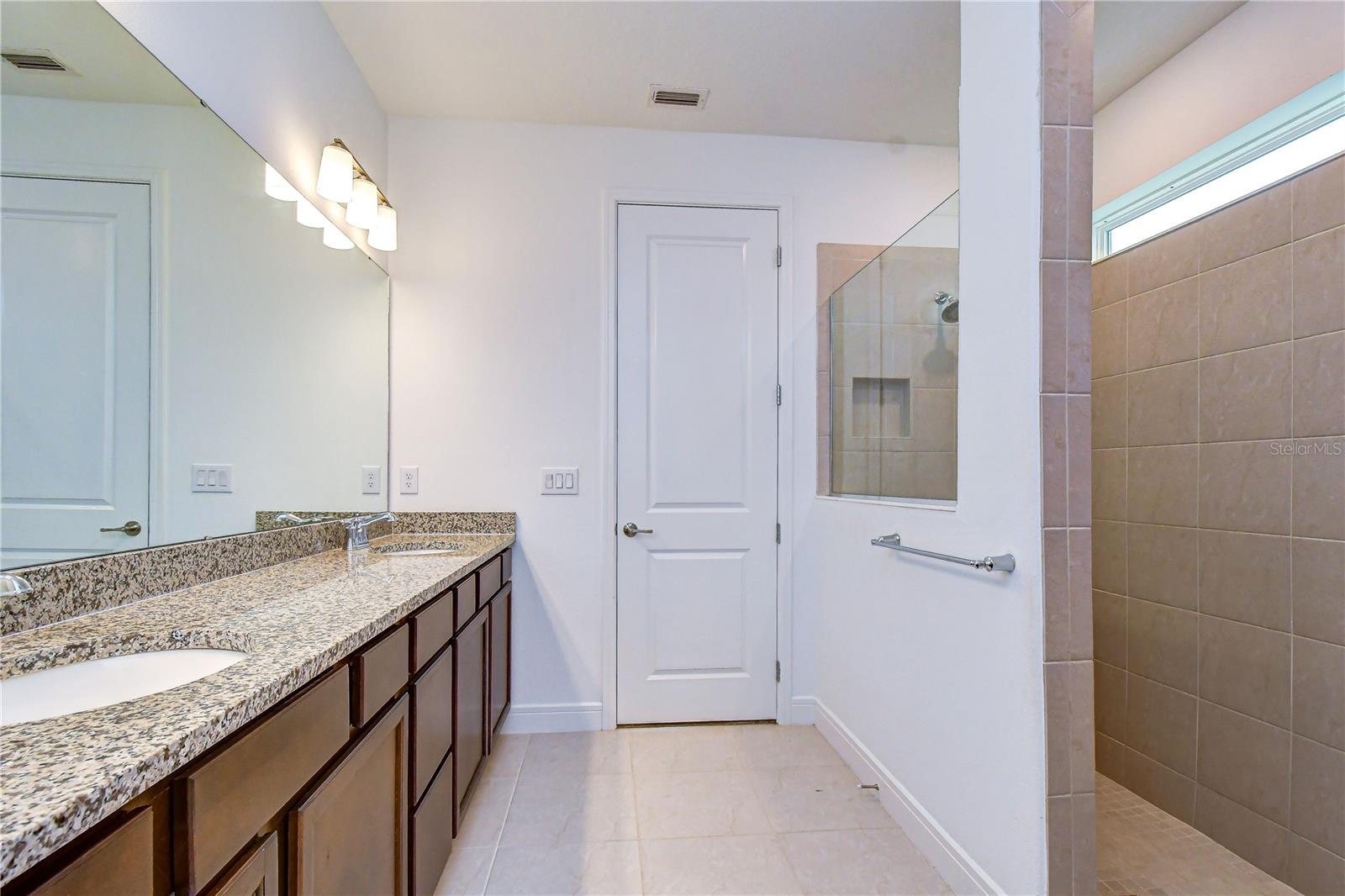 Beautiful private en-suite with oversized walk-in shower.