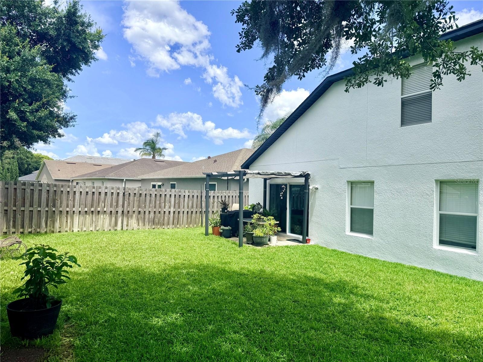A thoughtfully sized yard offers the ideal balance of outdoor living and low-maintenance upkeep, giving you more time to relax and less time behind a 