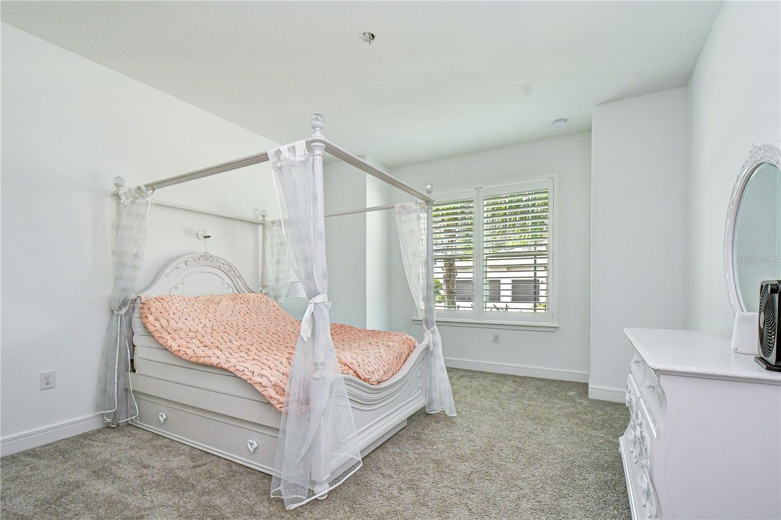 Private front bedroom ideal for guests or a home office.