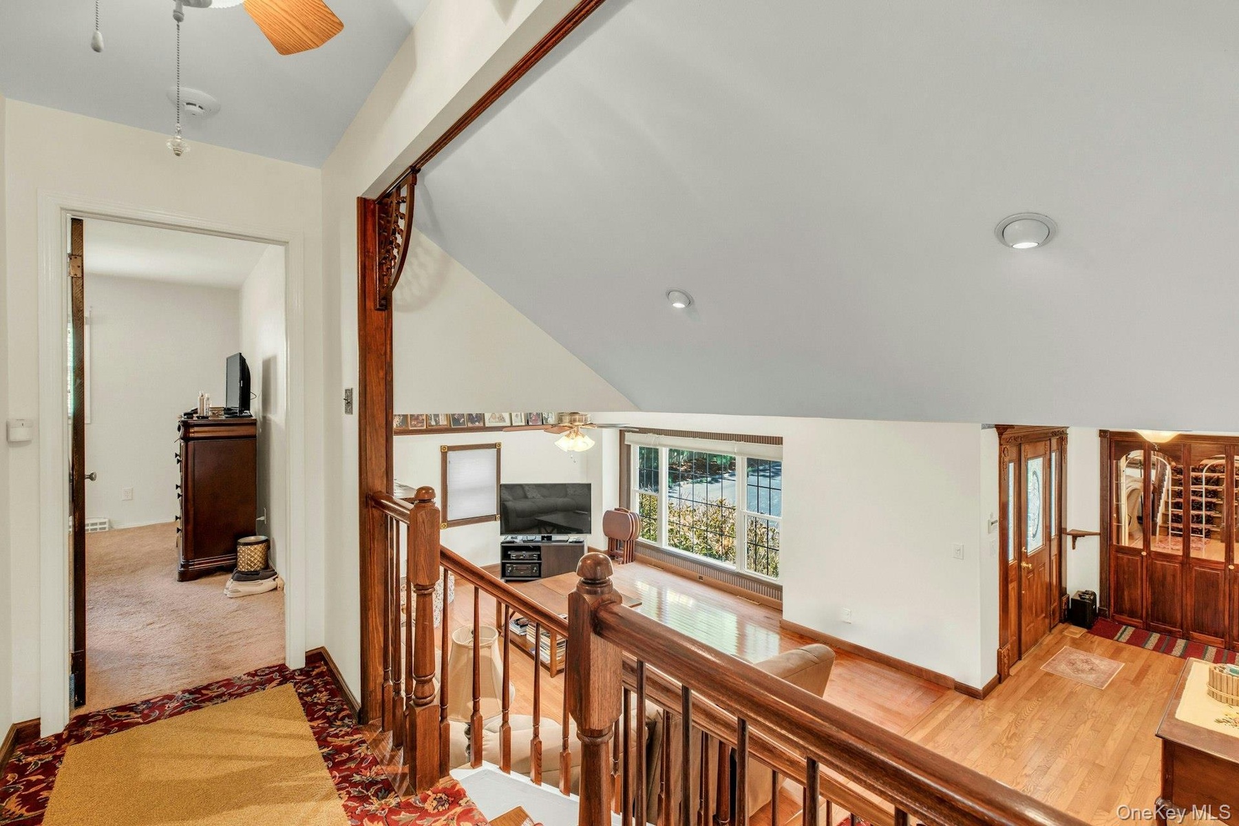 Staircase with wood railing and balusters