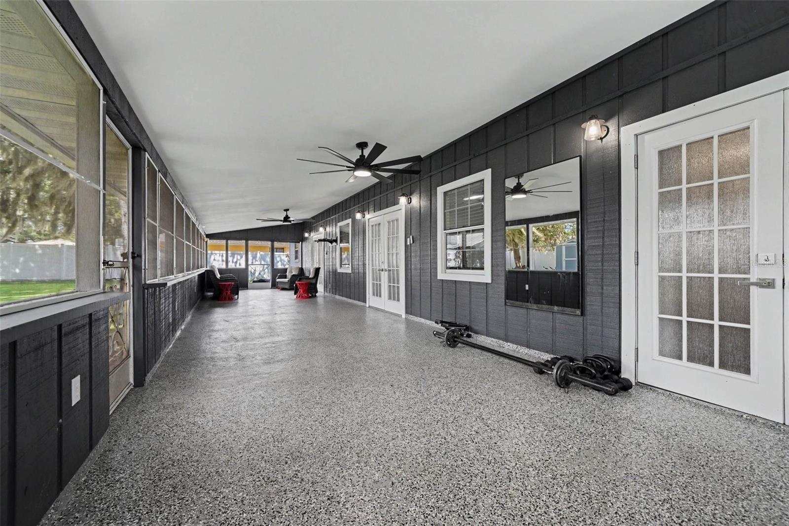oversized 50'5"x14'10" screened back porch w/2 ceiling fans