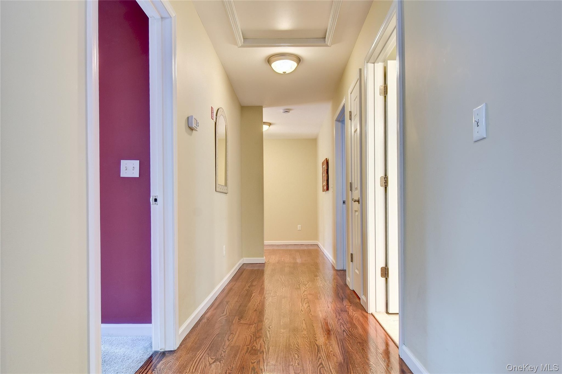 Hallway featuring wood flooring