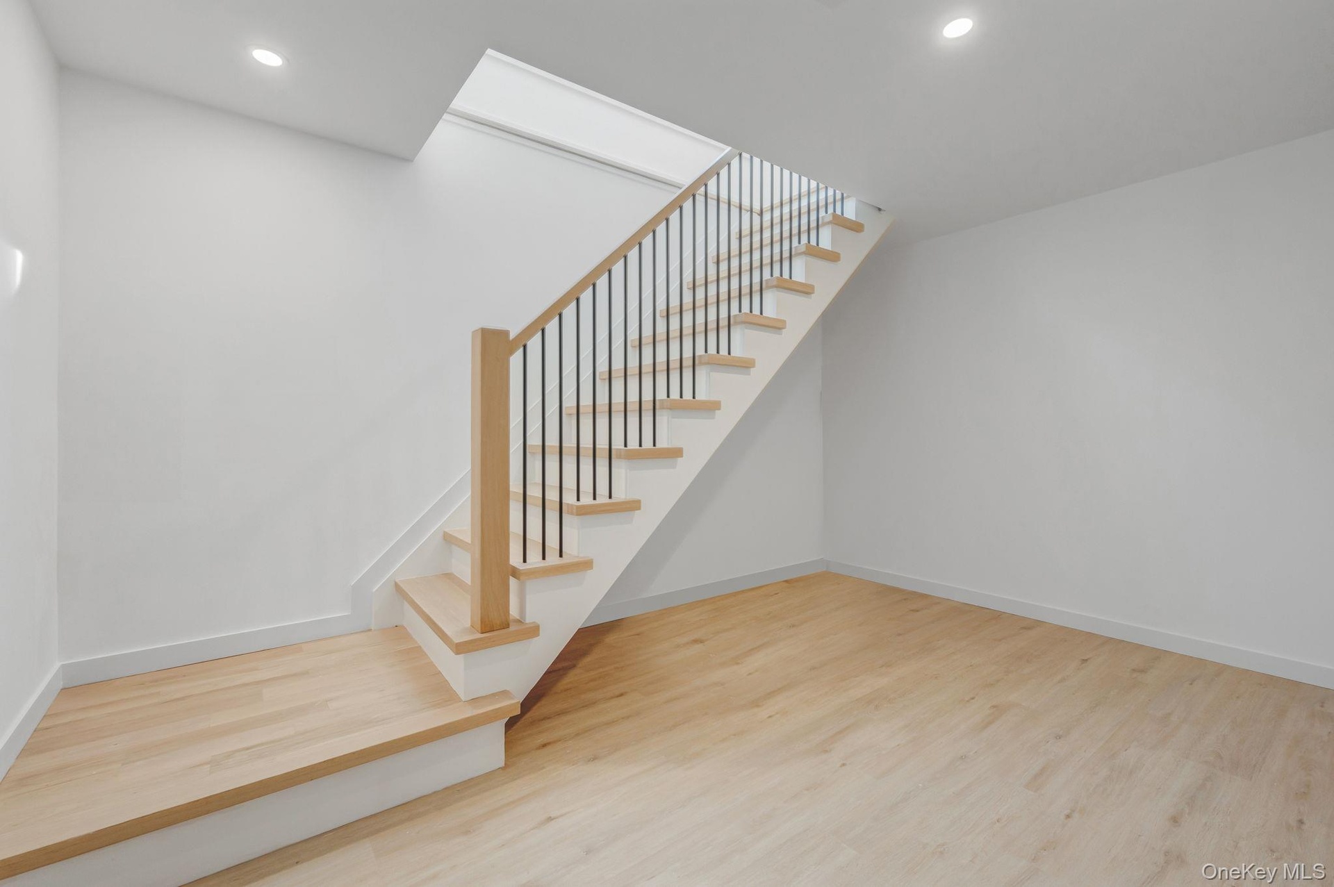 Full basement with high ceilings and outside entrance, offering excellent potential for future finished space or storage.