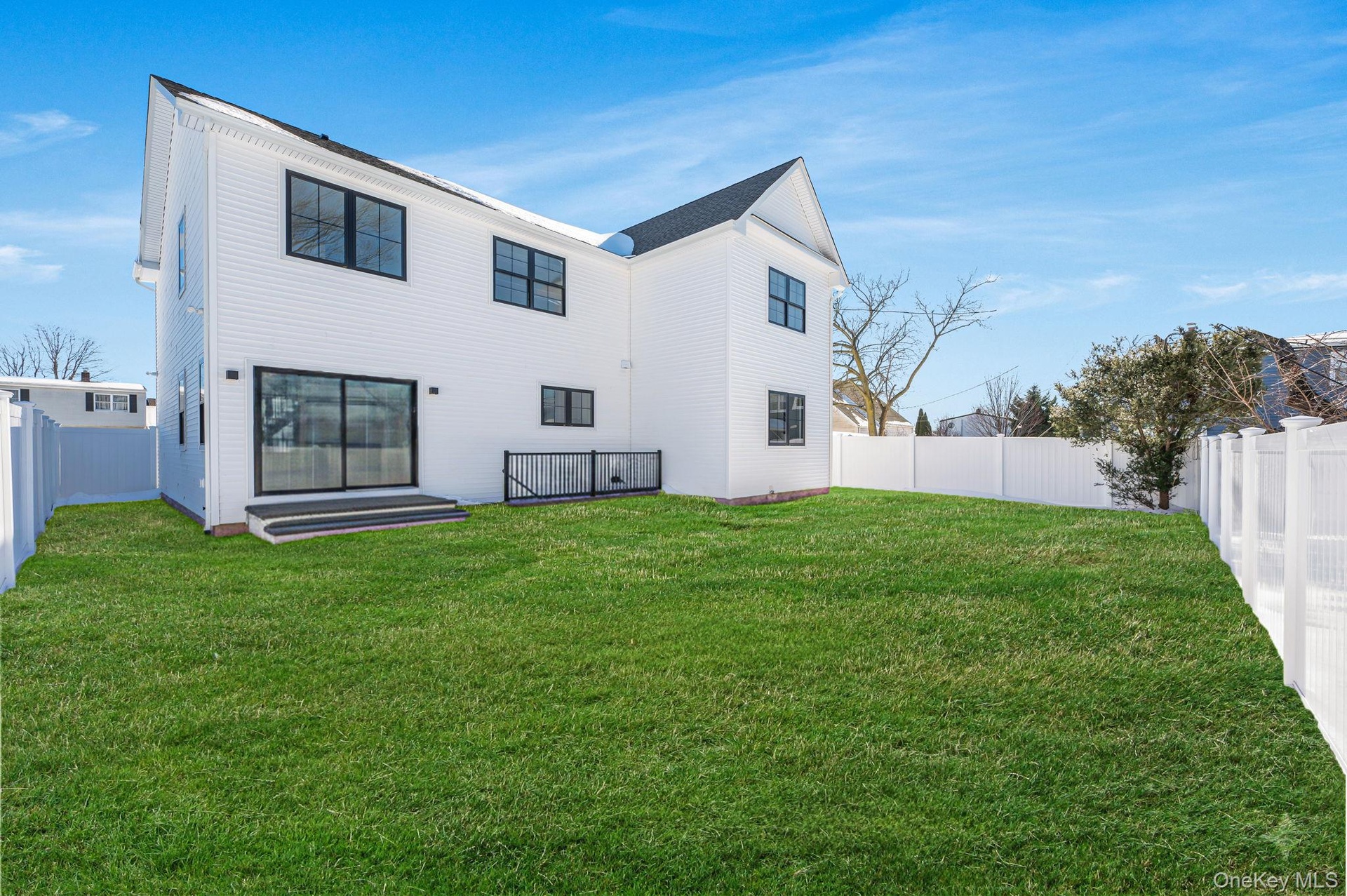 Level backyard space accessible from the main living area, providing room for outdoor enjoyment and entertaining.