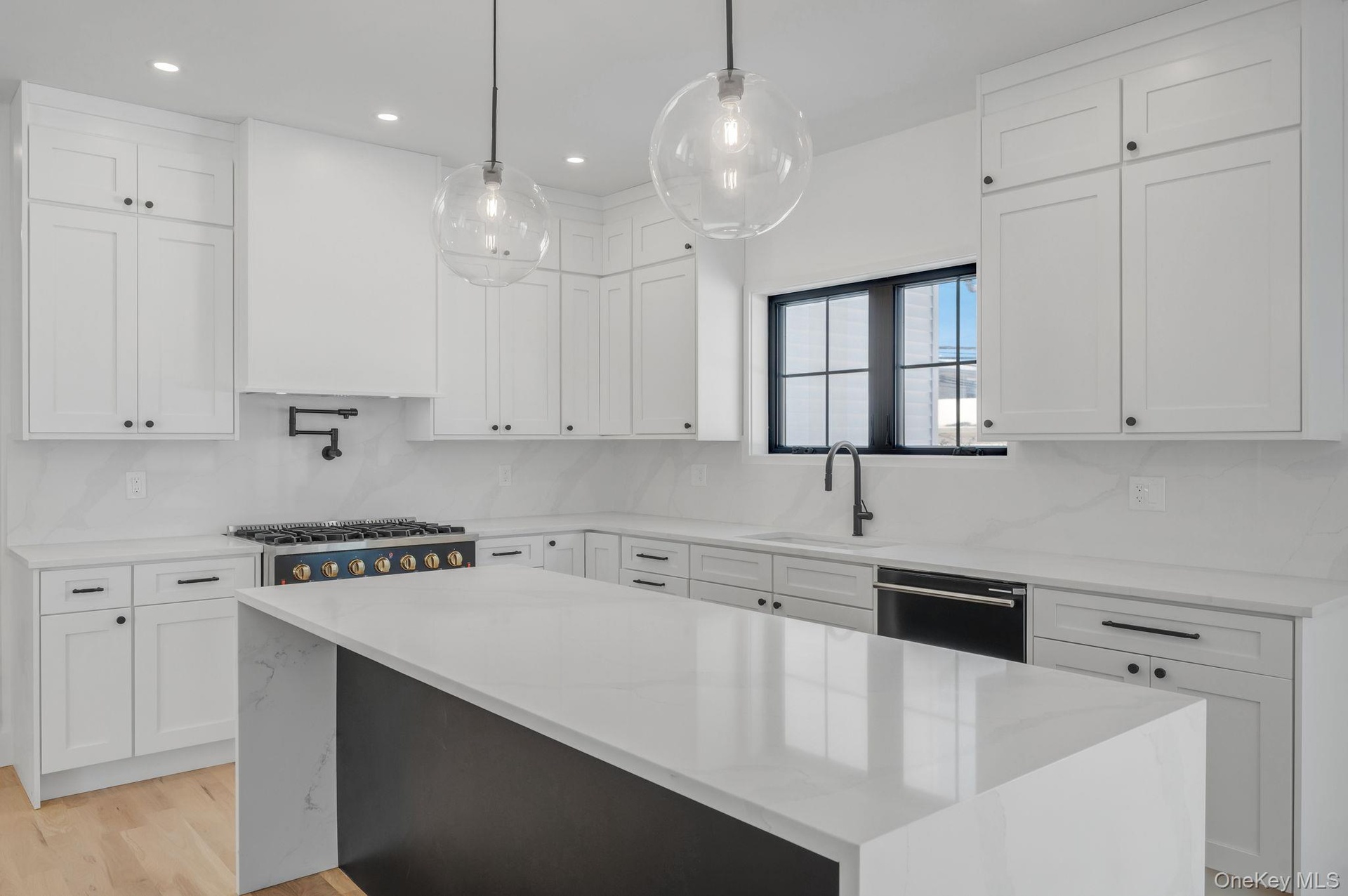 Thoughtfully designed kitchen featuring clean finishes, modern cabinetry, and an open layout that connects seamlessly to the dining area and main livi