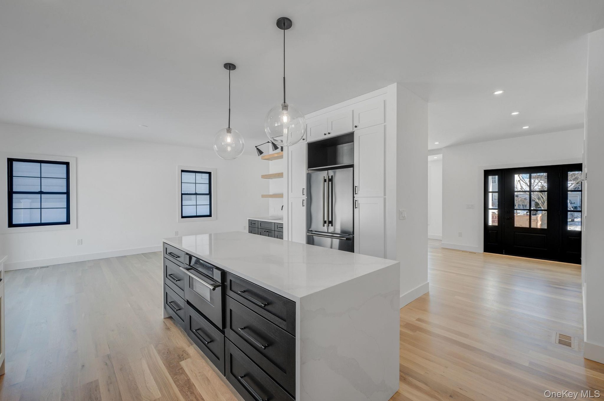 Thoughtfully designed kitchen featuring clean finishes, modern cabinetry, and an open layout that connects seamlessly to the dining area and main livi