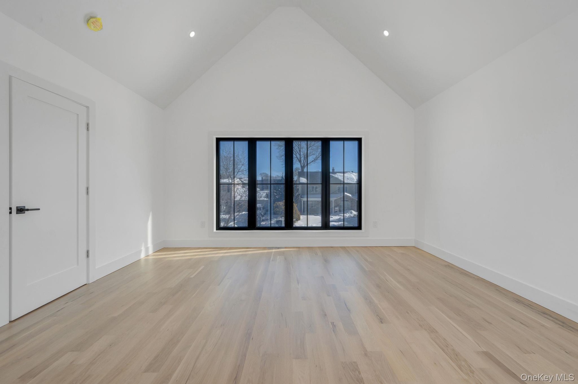 Spacious retreat with vaulted ceilings and large windows, dual walk in closets and primary bath.