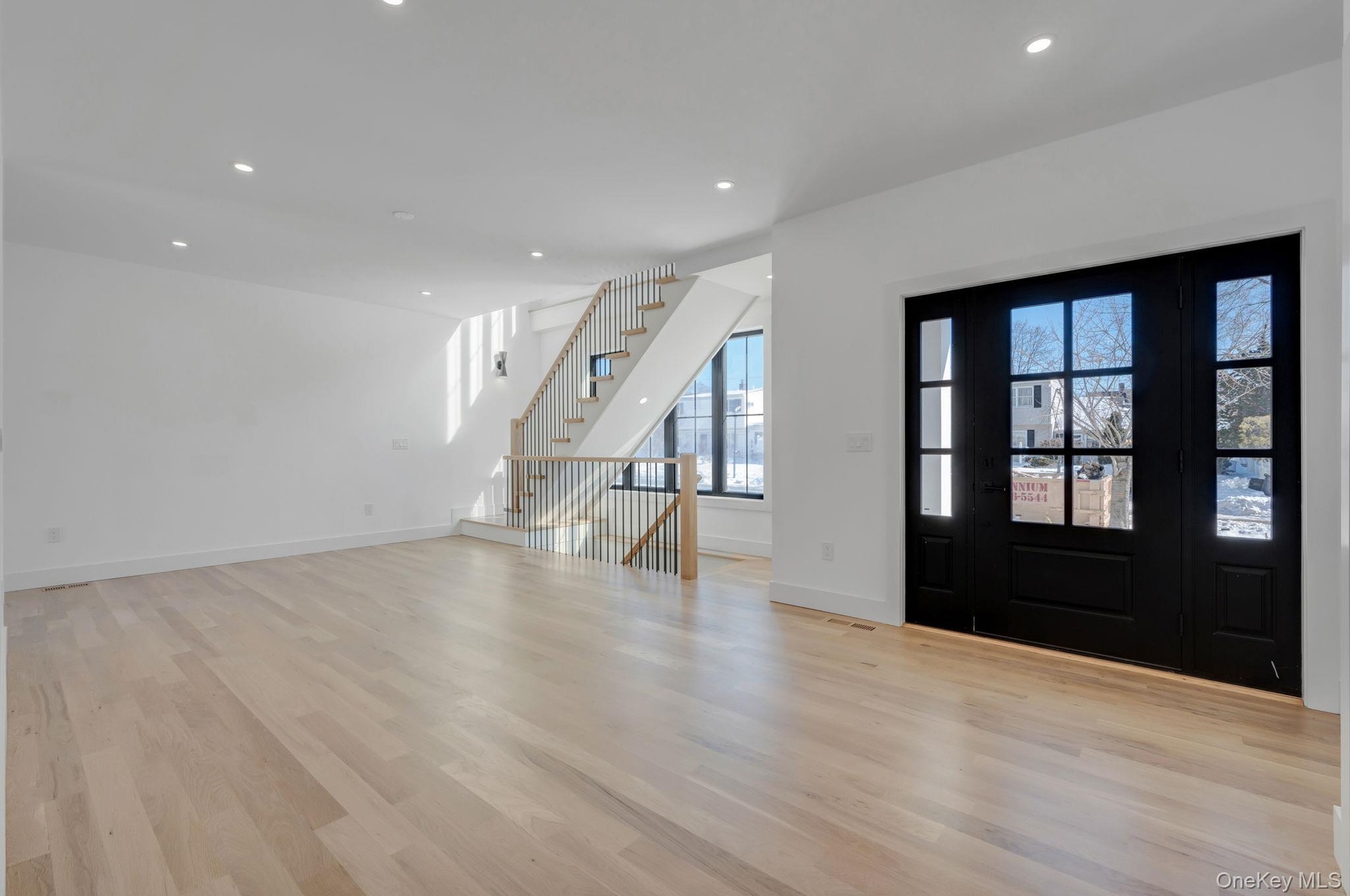Bright and welcoming entry with clean architectural lines and natural light that immediately sets the tone of the home.