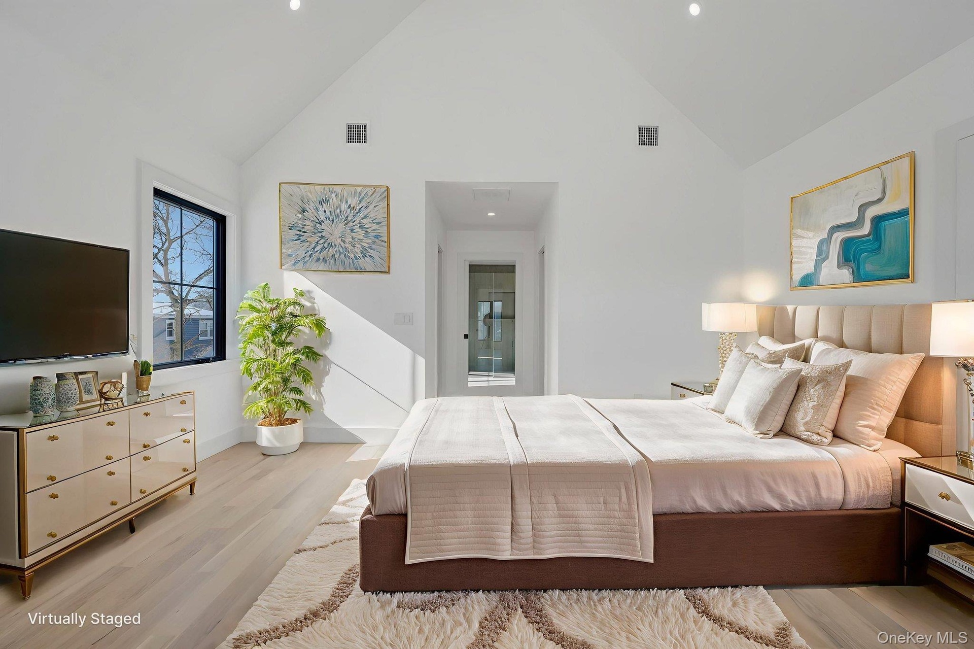 Spacious retreat with vaulted ceilings and large windows, dual walk in closets and primary bath. Virtually Staged.