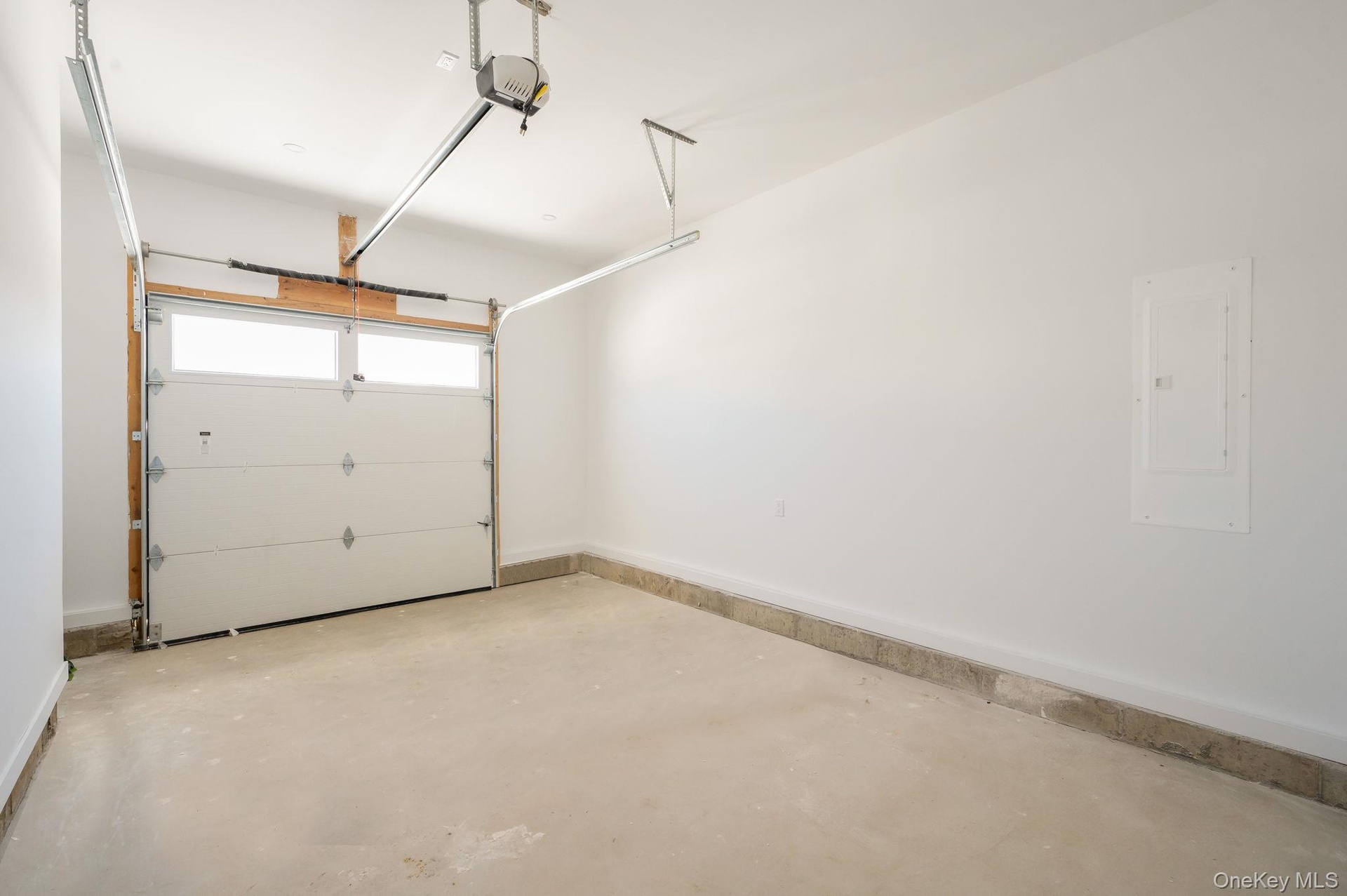One car garage with entry into mud room.