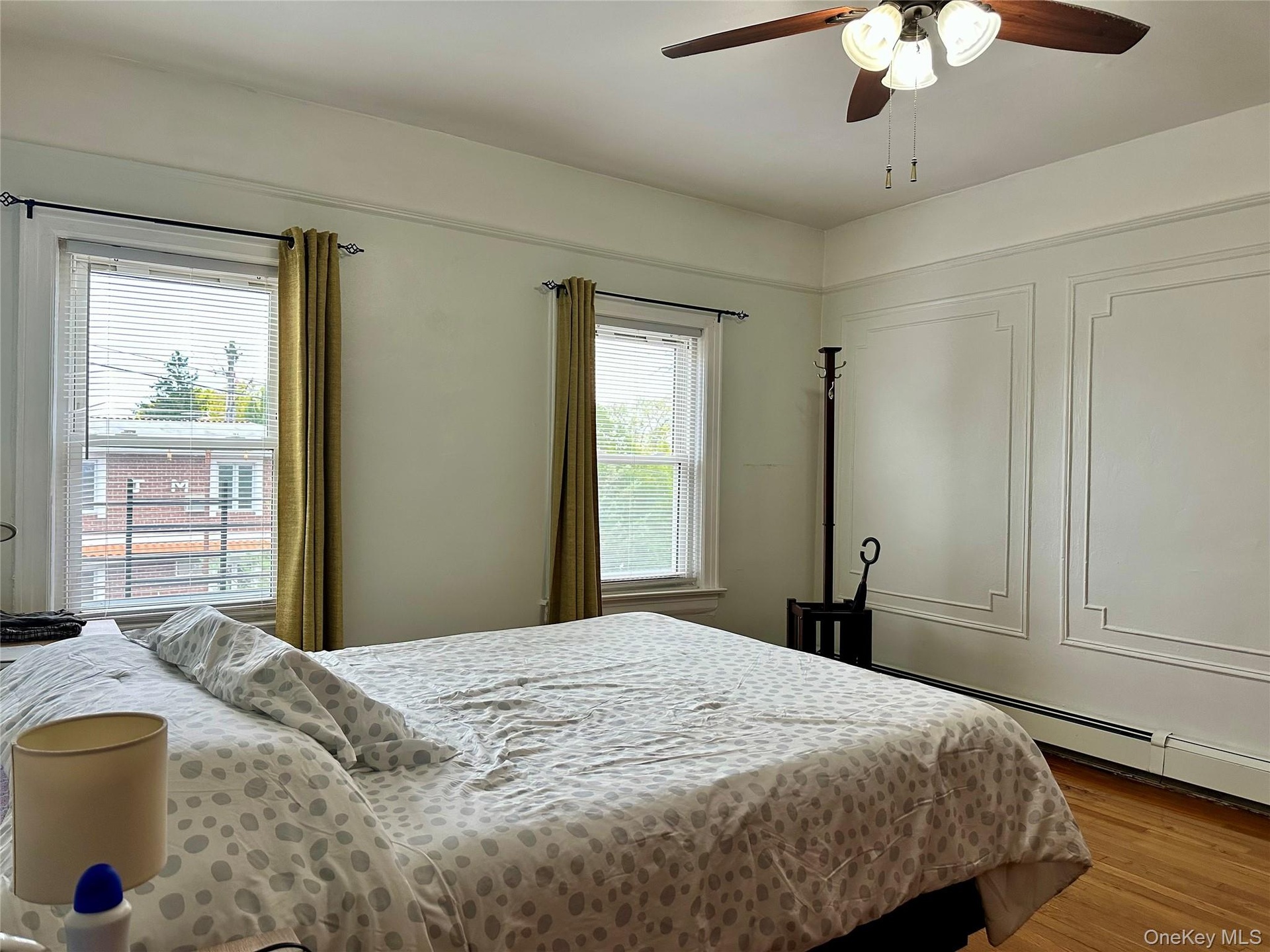 Bedroom with wood finished floors and ceiling fan