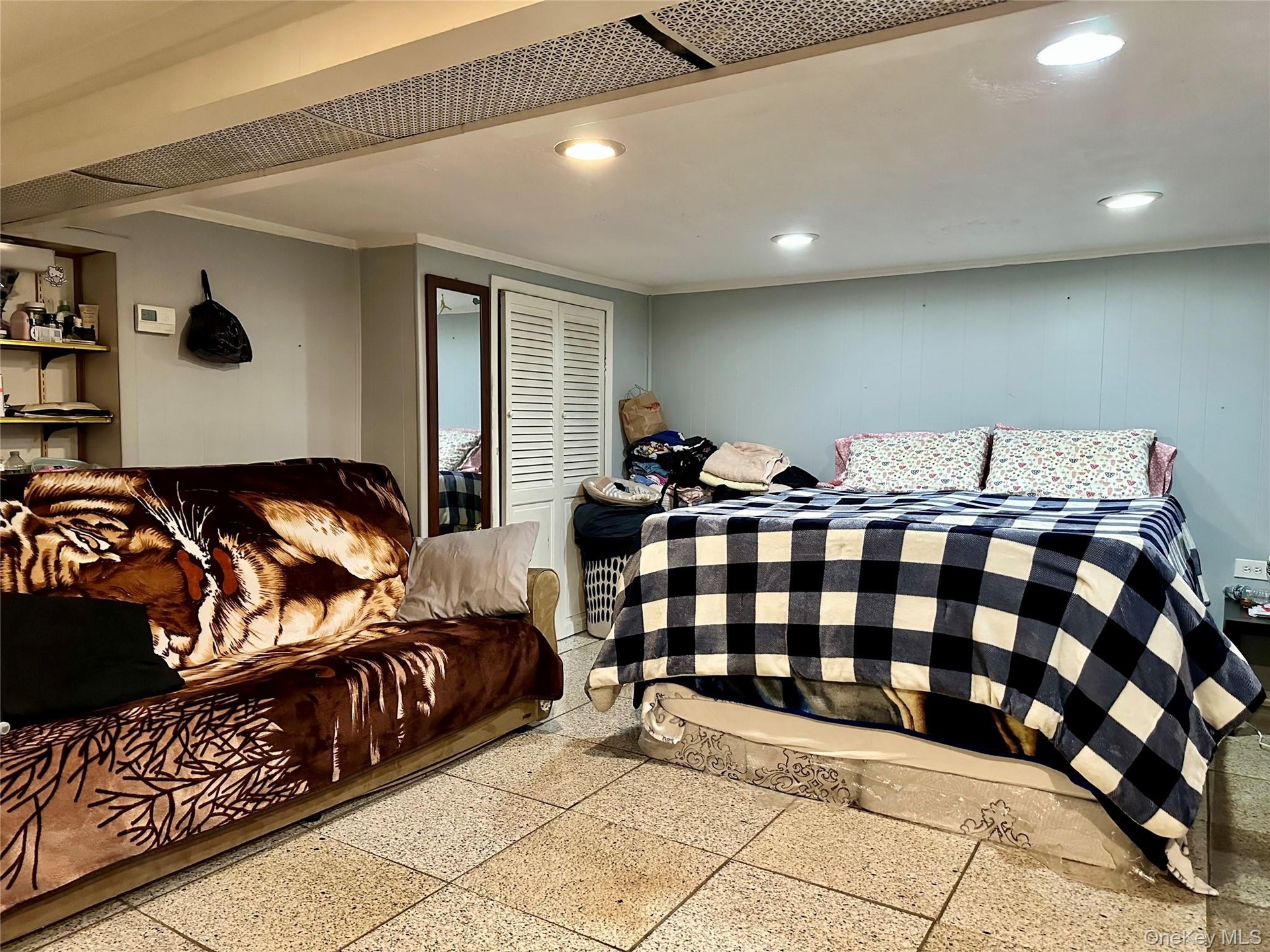 Bedroom with ornamental molding and recessed lighting